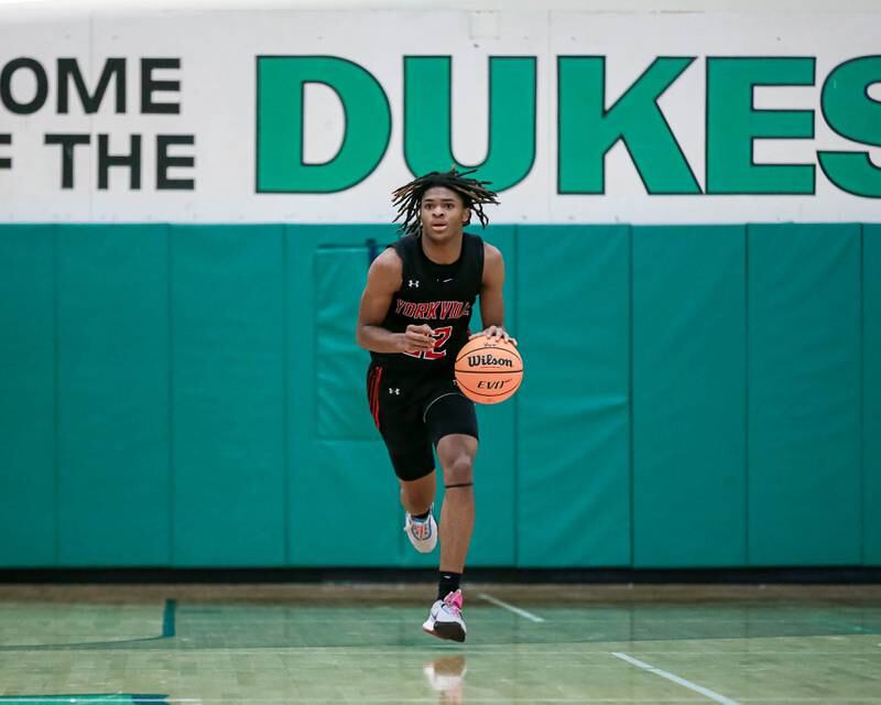 Yorkville's Braydon Porter (22) races down the court during their Jack Tosh Holiday Classic basketball tournament game between St Francis at Yorkville Thursday Dec 26, 2024 in Elmhurst.
