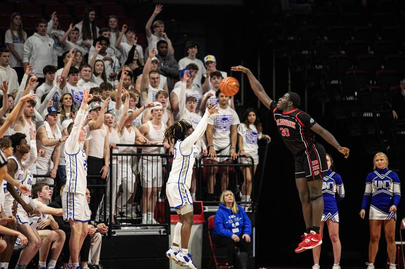 Bolingbrook's Michael Osei-Bonsu (30) blocks the shot of Quincy's Terron Cartmill in the fourth quarter of the Class 4A ISU Super-sectional, in Normal, on Monday, March 7, 2022.