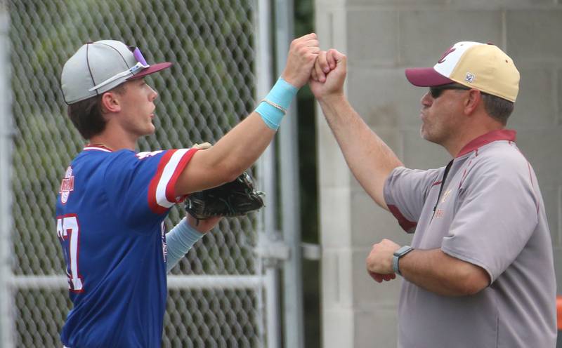 Morris head baseball coach fist bumps Reid Murray during the ICA Senior Baseball All Star Game on Monday, June 30, 2025 at Schweickert Stadium in Peru.