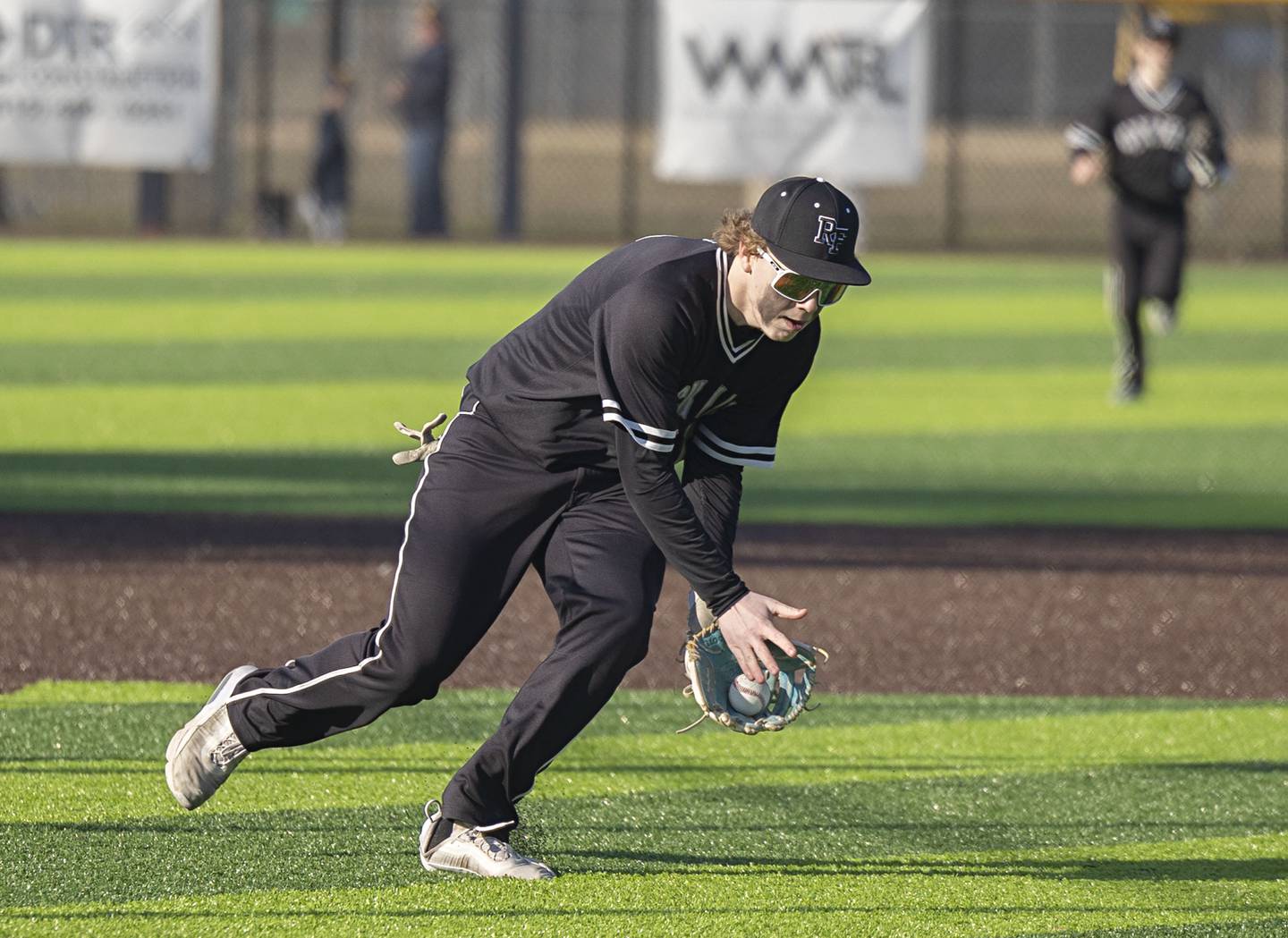 Rock Falls’ Tim Heald field a ball at third base against Sterling Tuesday, March 28, 2023.