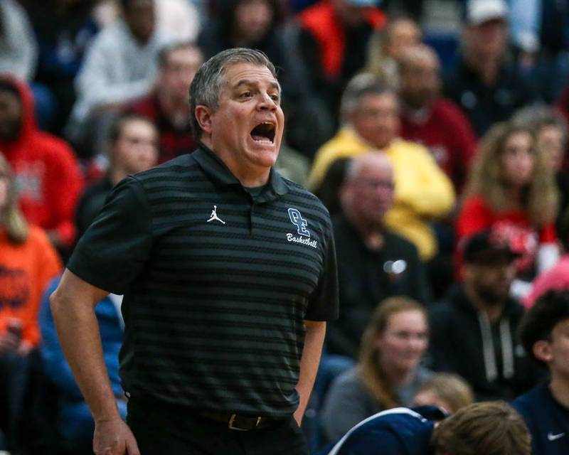 Oswego East's head coach Ryan Velasquez yells out instructions during their basketball game between Oswego at Oswego East, Feb 13, 2026 in Oswego.