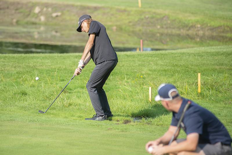 Rock Falls’ Carter Dillon chips towards the #1 green while facing off against Sterling on Sept. 14, 2022.