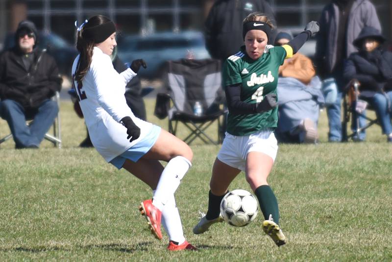 Bishop McNamara's Lydia Nugent, right, and Kankakee's Regina Vazquez-Vargas battle for possession during All-City action at McNamara Saturday, March 22, 2025.