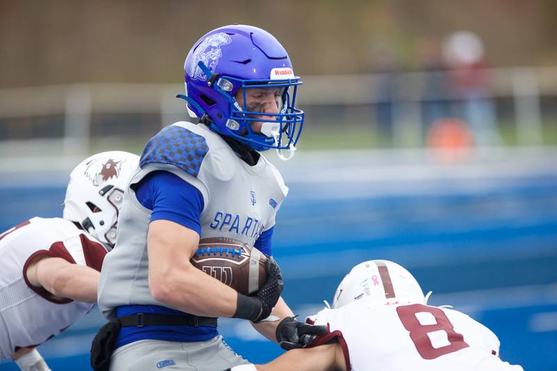 St. Francis Tanner Glock runs the ball for a gain against Prairie Ridgeat the Class 5A second-round playoff game on Saturday Nov.9,2024 in Wheaton.