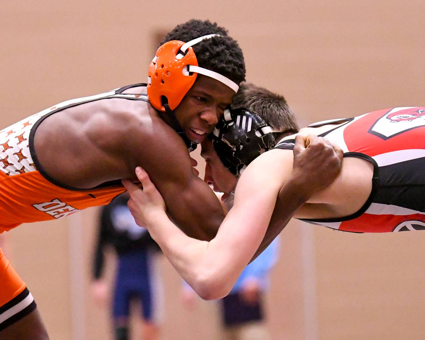 Sam Howard of DeKalb, right, tries to control Cole Forsyth of Glenbard East on Tuesday Dec. 30, 2025, in the 120-weight class during the Flavin Invite held at DeKalb High School.
