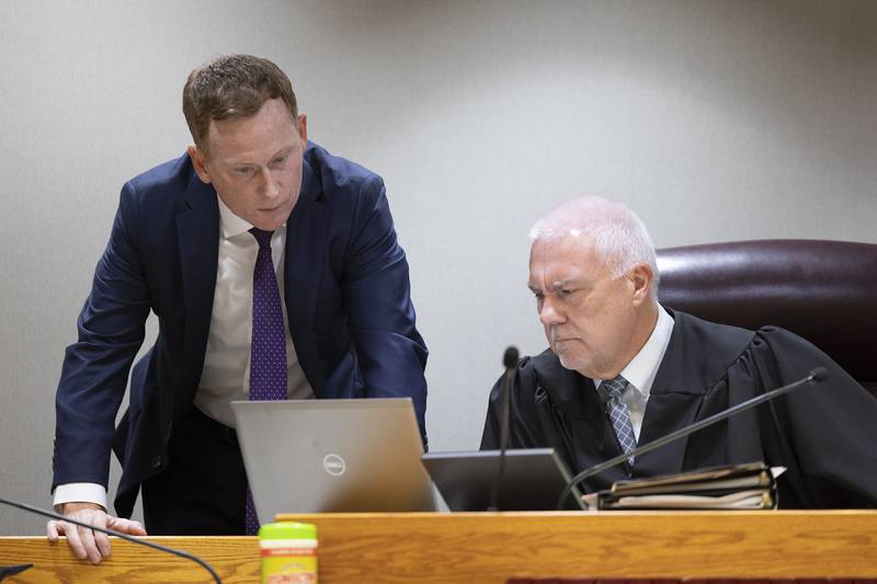 Michael Gallagher (left) attorney for Brittney Ramos, speaks with Judge James Heuerman on Tuesday, Nov. 4, 2025, at the start of the Garrett Ramos wrongful death civil trial.