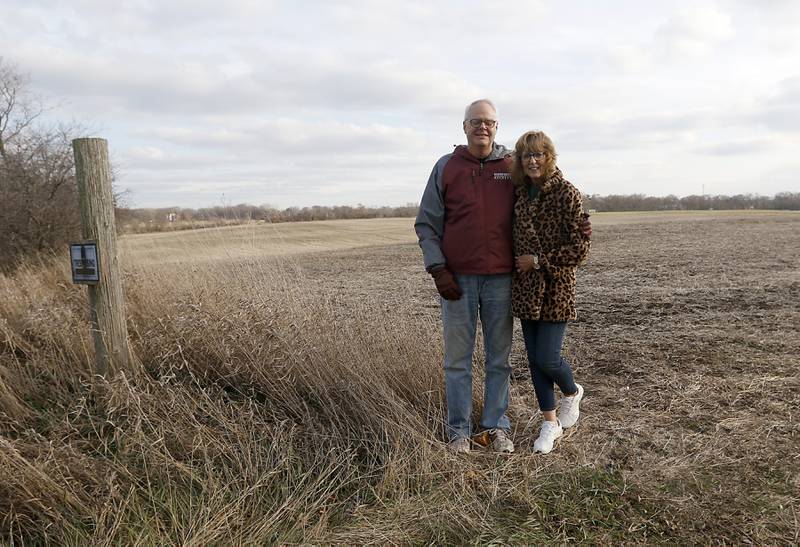 Ron and Linda Bryant stand in a farm field Monday, Nov. 28, 2022, near their home at 8219 Country Shire Lane in Fox Lake. The land was purchased by Super Aggregates to develop into a gravel pit, an idea the Bryants and their neighbors oppose.