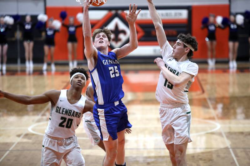 Geneva’s Hudson Kirby gets a shot past Glenbard West's Logan Glover and Glenbard West's Drew Gacek during the Class 4A St. Charles East Sectional final on Friday, March 7, 2025 in St. Charles.
