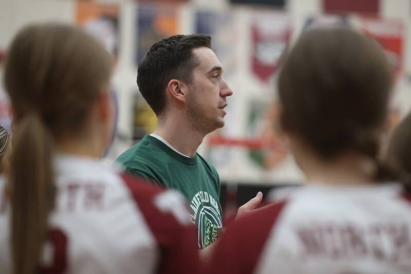 Plainfield North head coach Matt Slechta talks with his team between sets against Plainfield East on Thursday night.
