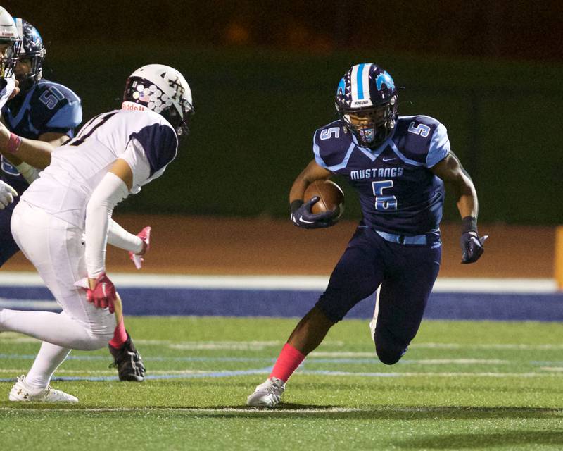 Downer's Grove South's Kayden Smith looks for running room against Addison Trail on Friday, Oct.20,2023 in Downers Grove.