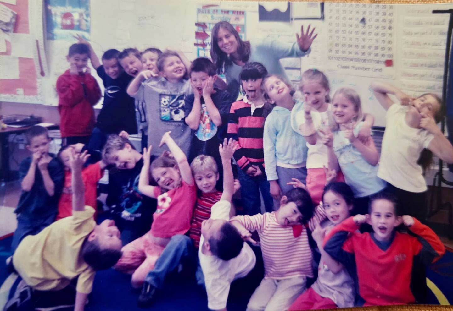 St. Charles School District 303 teacher and reading specialist Amy Kappele poses with a class of elementary school students.