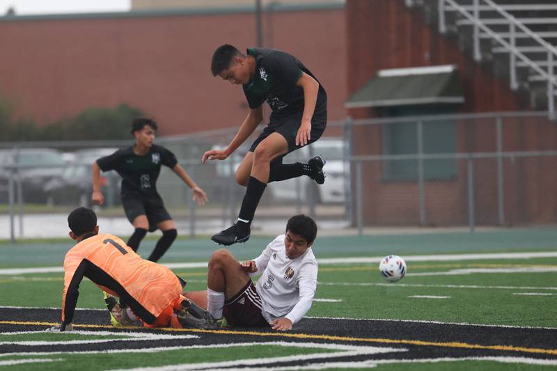 Plainfield Central’s Sebastian Chavez hurdles the Morris defenders on a deflected shot on Monday, Sept. 11, 2023 in Plainfield.