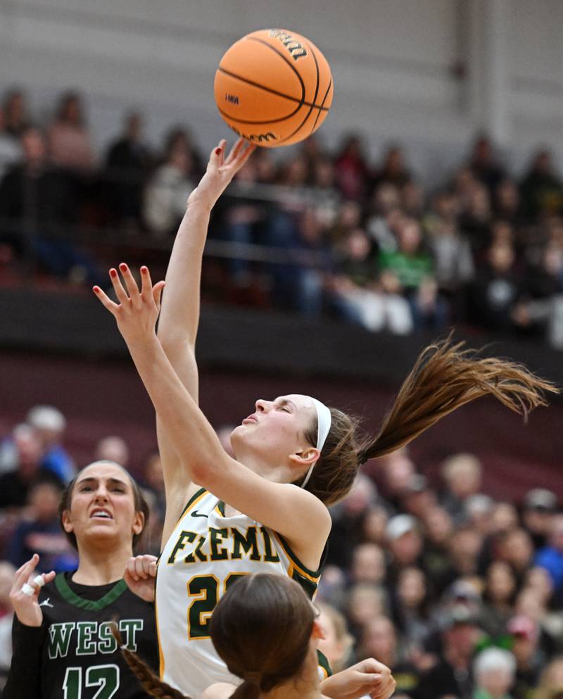 Fremd's Ella Todd get fouled on her way to the basket during the Hersey Class 4A supersectional against Glenbard West at Forest View Education Center on Monday, March 3, 2025 in Arlington Heights.