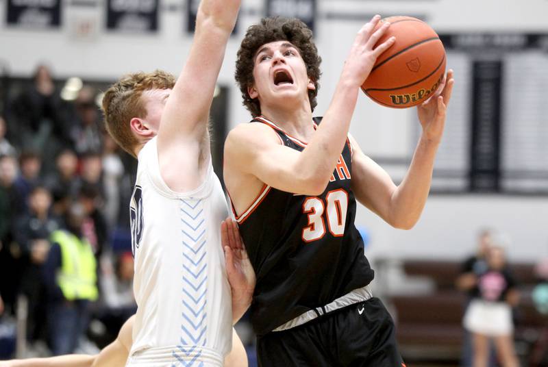 Wheaton Warrenville South’s Luca Carbonaro goes up for a shot during a game at Lake Park in Roselle on Friday, Feb. 10, 2023.