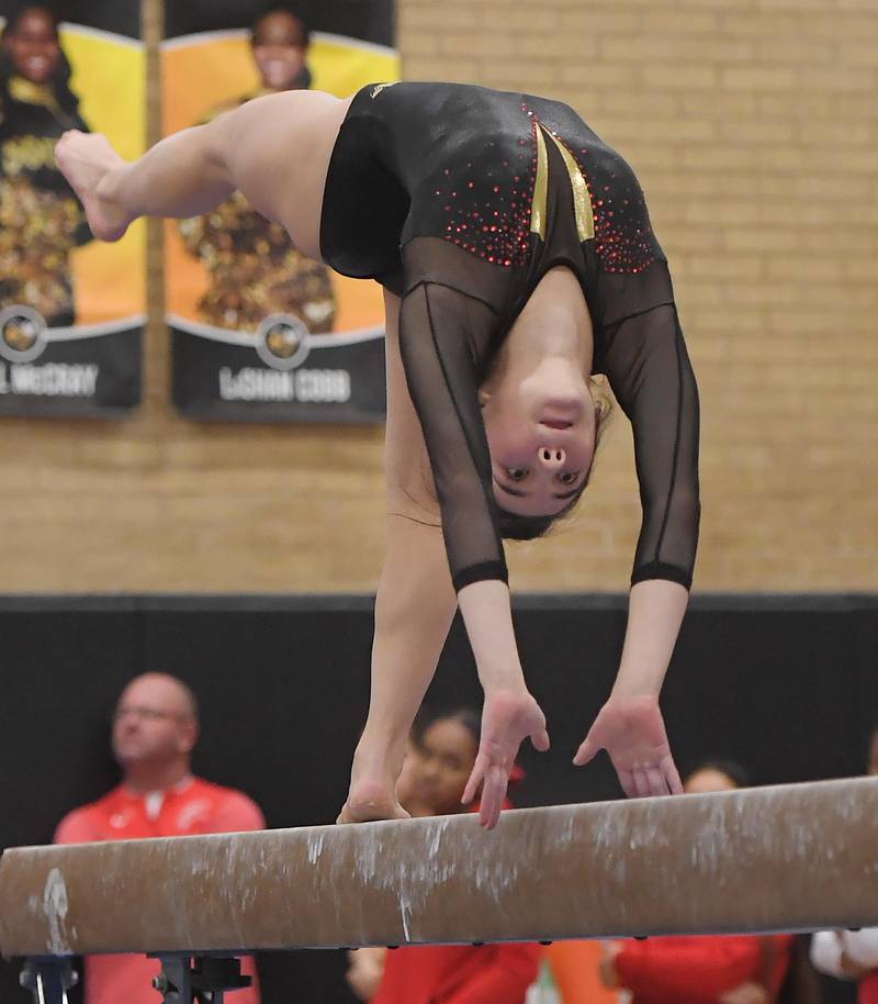 Batavia's Wynne Tien on the balance beam at the Hinsdale South girls gymnastics sectional meet in Darien on Tuesday, February 7, 2023.