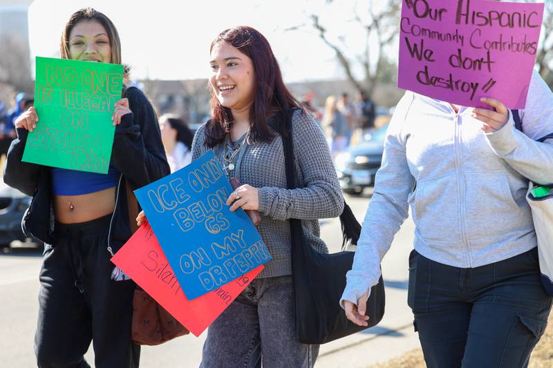 Kankakee High School students carry signs as they participate in a walkout in protest of national immigration policies and Immigration and Customs Enforcement actions on Friday, Feb. 13, 2026.