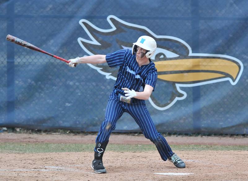 Nazareth's Nick Drtina hits an RBI sacrifice fly during a game against Benet Academy on Apr. 12, 2022 at Nazareth Academy in LaGrange Park.