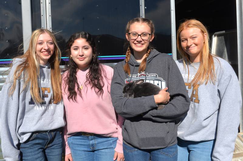 Forreston FFA member Emily Bocker (far left) brought her rabbit "Shadow" to the Forreston FFA's Ag Day on Friday, April 12, 2024. Pictured with Bocker are Hayden Harvey, Maylin Macias, and Madison Zipse. The FFA members ran all stations at the petting zoo and talked about their animals and farm machinery during the morning event.
