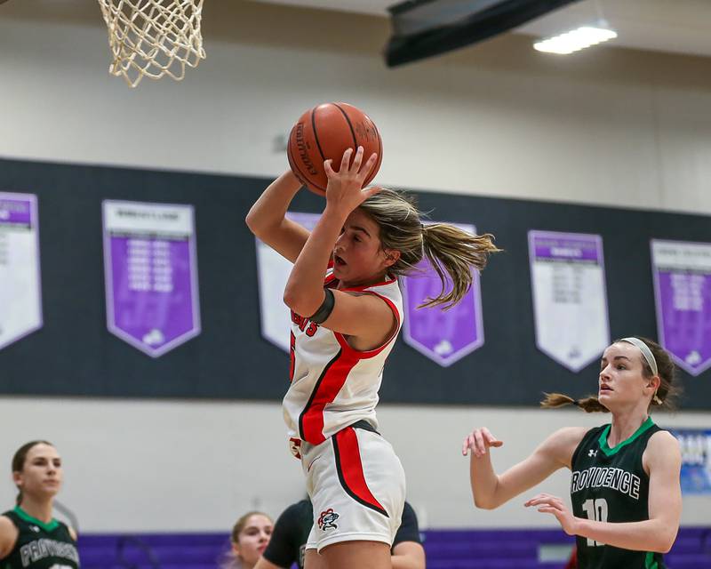 Lincoln Way Central's Gianna Amadio (15) grabs a rebound in the WJOL Tournament Championship game. Nov 18, 2023.