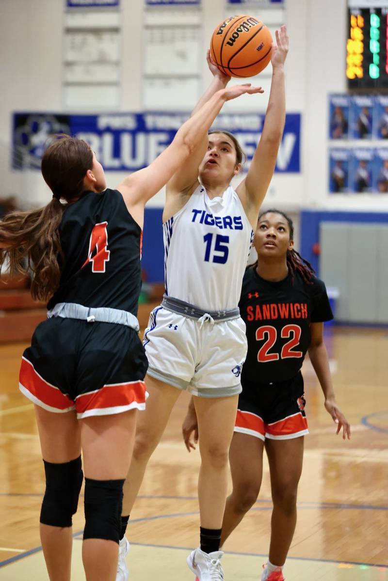 Princeton's Olivia Mattingly shoots over Sandwich's Hannah Treptow in regional semifinal play Tuesday at Prouty Gym. The Tigresses won 50-35..