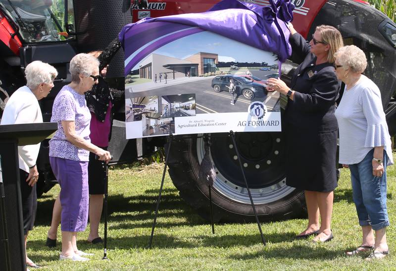 (From left) Joyce Muraro, Jackie Foster and Joan Zellmer watch Kathy Ross, Vice President of Business Services and Fiance and Dr. Tracy Morris, President of Illinois Valley Community College, unveil a photo of the new Dr. Alfred E. Wisgoski Agricultural Education on Friday, Aug. 22, 2025 at Illinois Valley Community College in Oglesby. The new building, received a one-million dollar donation from the Wisgoski family, funds from the federal Economic Development Administration and the state of Illinois Department of Commerce and Economic Opportunity, will not only provide physical spaces that reflect the program’s growth, innovation, and capabilities, but the IVCC Agricultural Education Center will also serve as a focal point for agricultural industry activities within the community. The building will take one-year to complete.