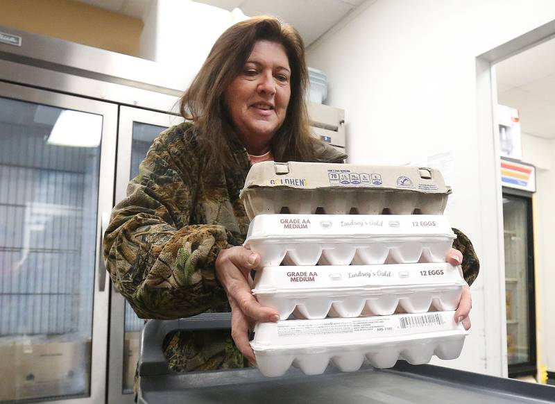 No eggs, and dye kits for Easter food baskets? Executive director Mary Jo Credi holds her last four-dozen eggs on Monday, Feb. 10, 2025 inside the Illinois Valley Food Pantry in La Salle. "I'm worried about our Easter distribution," said Credi. The Illinois Valley Food Pantry always includes a dozen eggs and a food coloring kit for families during Easter distribution.