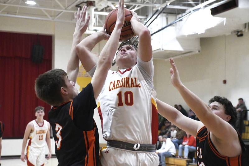 St. Anne's Grant Pomaranski goes up for a shot while contested by Gardner-South Wilmington's Cooper Biros during St. Anne's 52-45 victory over Gardner-South Wilmington on Tuesday, January 13, 2026.