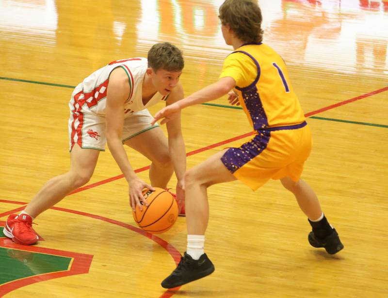 L-P's Kyle Spelich looks to dribble around Rantoul's Levi Duitsman on Friday, Dec. 19, 2025 in Sellett Gymnasium at L-P High School.