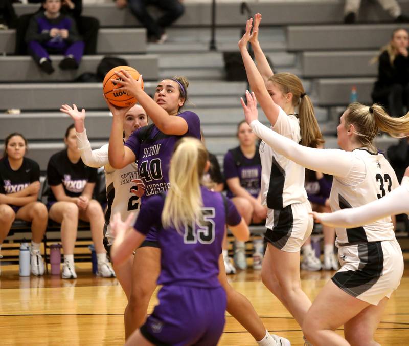 Dixon’s Hallie Williamson goes up for a shot during a game at Kaneland on Monday, Dec. 2, 2024 in Maple Park.