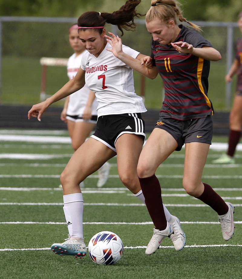 Woodlands Academy’s Maddie Montez tries to take the ball from Richmond-Burton's Margaret Slove during a IHSA Division 1 Richmond-Burton Sectional semifinal soccer match Tuesday, May 16, 2023, at Richmond-Burton High School.