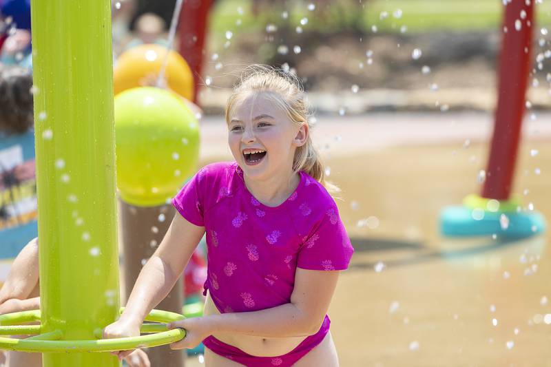 Kortlyn Workman, 7, of Morrison plays with a water feature Wednesday, June 11, 2025, at Water Wonderland splash pad in Dixon. The pad was the hottest place in town as temps crept up and locals were looking for a place to chill out.