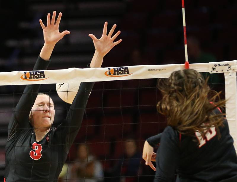 Benet Academy's Kristen Krammer (15) sends a kill past Barrington's Hope Regas (3) in the Class 4A semifinal game on Friday, Nov. 11, 2022 at Redbird Arena in Normal.