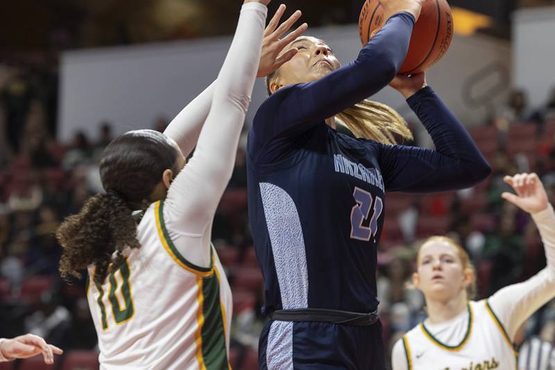 Nazareth Academy’s Olivia Austin puts up a shot against Waubonsie Valley’s Danyella Mporokoso Friday, March 1, 2024 in the girls basketball 4A state semifinal at CEFCU Arena in Normal.