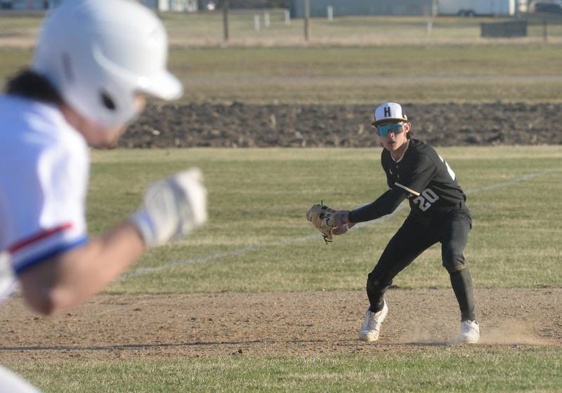Harvard's Justin Wheeler fields a ground ball and prepares to throw to first for an out against Oregon on Monday, March 23, 2026 at Oregon High School.
