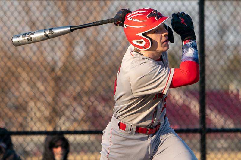 Yorkville's Joe Onasch (25) drives in a run on a sacrifice fly against Marmion during a baseball game at Marmion High School in Aurora on Tuesday, Mar 28, 2023.