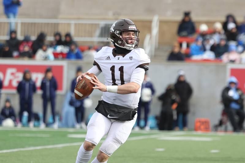 Joliet Catholic’s Lukes Simulick looks to pass against Nazareth in the Class 5A state championship on Saturday, Nov. 30, 2024 in Normal.