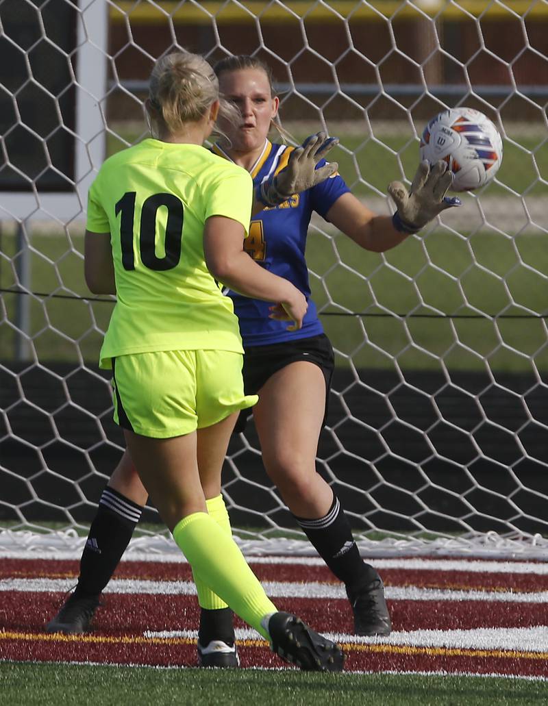 Johnsburg goalie Sophie Person tries to stop the kick from Richmond-Burton's Maddie Seyller during the Kishwaukee River Conference Girls Soccer Tournament Championship Match on Wednesday, May 1, 2024, at Richmond-Burton High School. Seyller score the teams second goal.