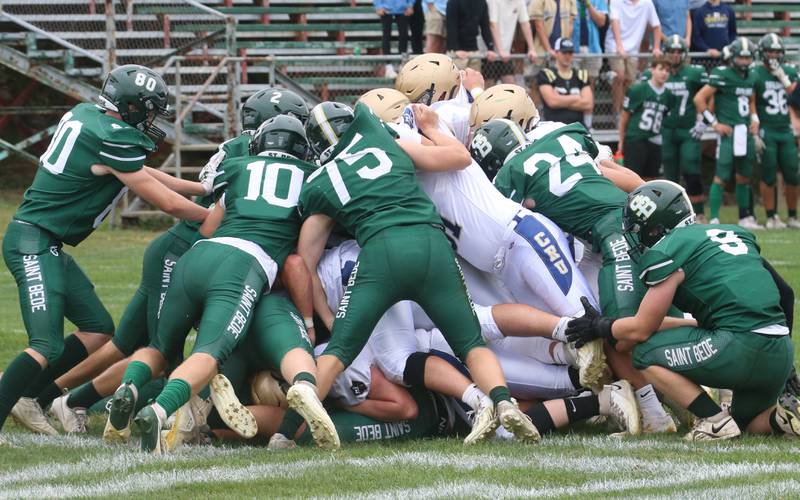 St. Bede defense piles on top of the Marquette offense on the goalline during the game on Saturday, Sept. 28, 2024 at St. Bede Academy.