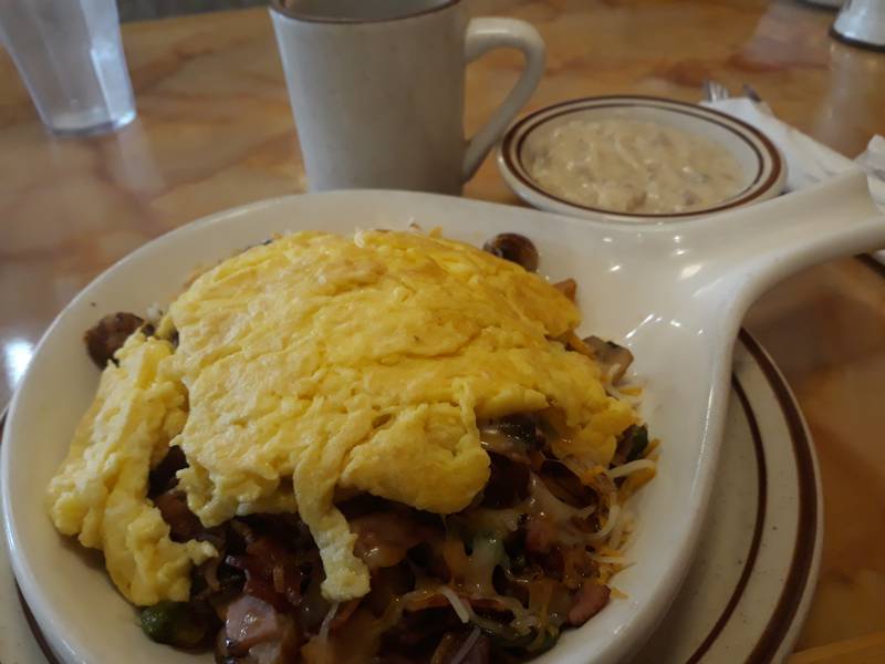 The countryside skillet at Country House Restaurant in La Salle is filled with bacon, ham, sausage, potatoes, mushrooms, onions, peppers, shredded cheddar and pepper jack cheese and eggs.