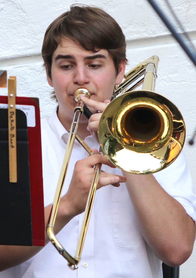 A trombone player reads his music Tuesday, June 21, 2022, during the DeKalb Municipal Band concert at Hopkins Park in DeKalb. The band presents concerts at 7:30 p.m. during the summer every Tuesday through August 23, with the exception of July 5.