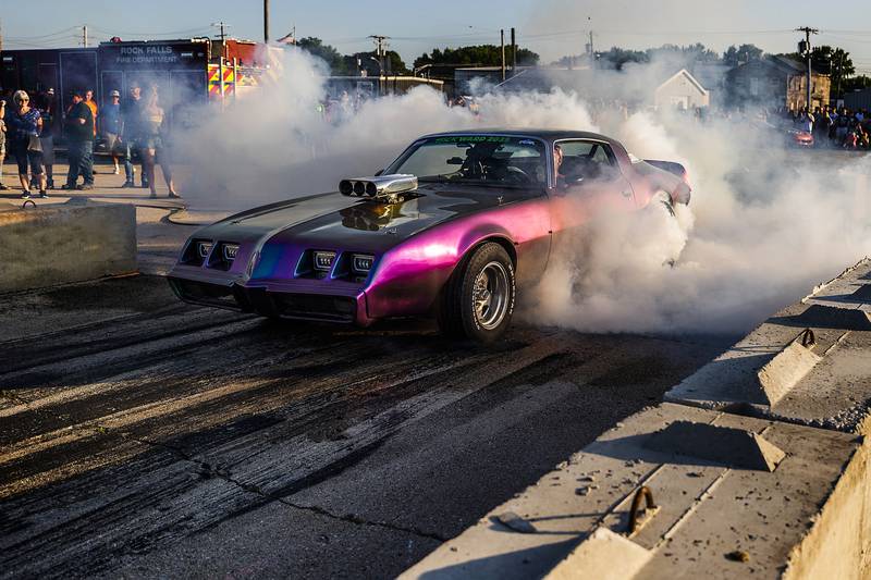 Smoke billows from the spinning tires of a burnout artist Thursday, June 19, 2025, in Rock Falls.