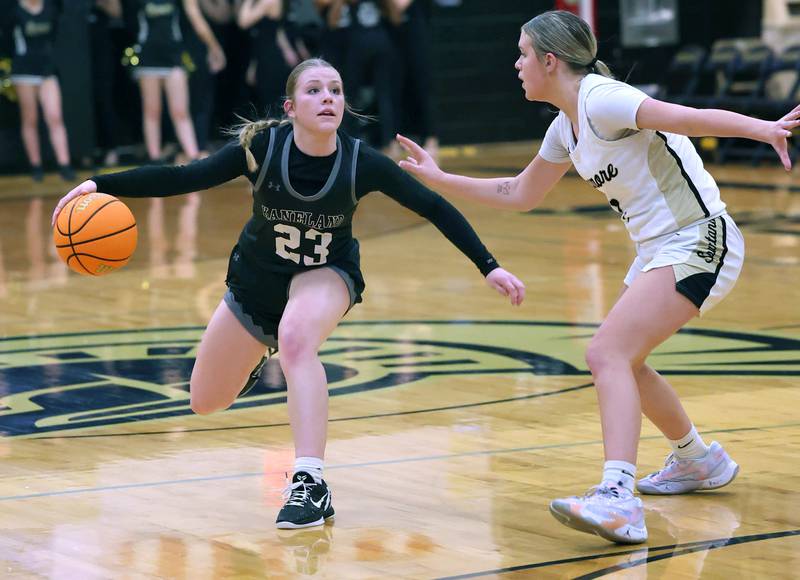 Kaneland's Kendra Brown works against the defense of Sycamore's Quinn Carrier during their game Wednesday, Feb. 7, 2024, at Sycamore High School.
