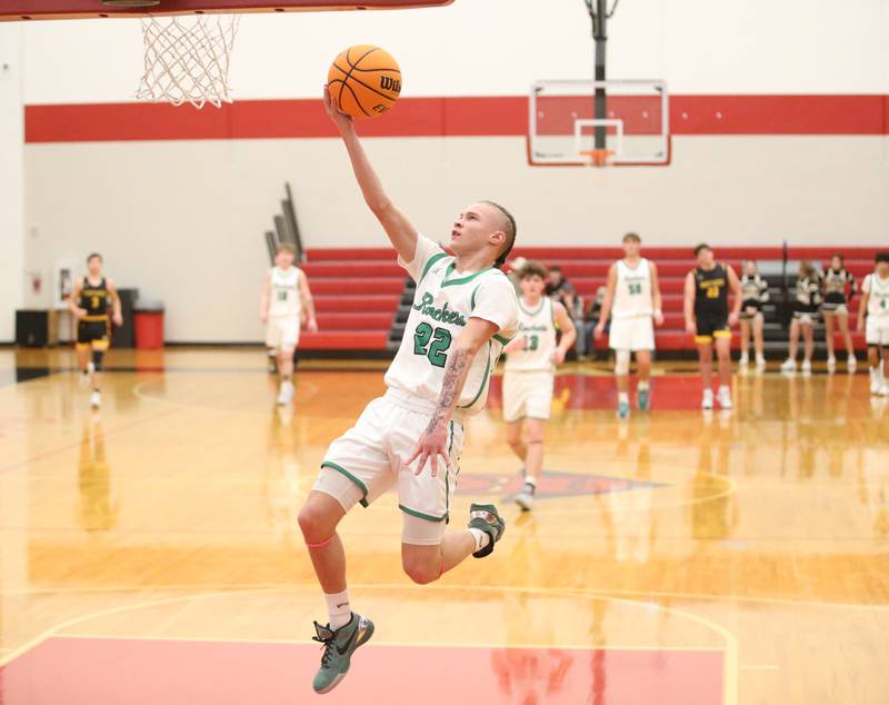 Rock Falls's Austin Castaneda eyes the hoop against Putnam County's AJ Furar during the 50th annual Colmone Classic on Monday, Dec. 9, 2024 at Hall High School.