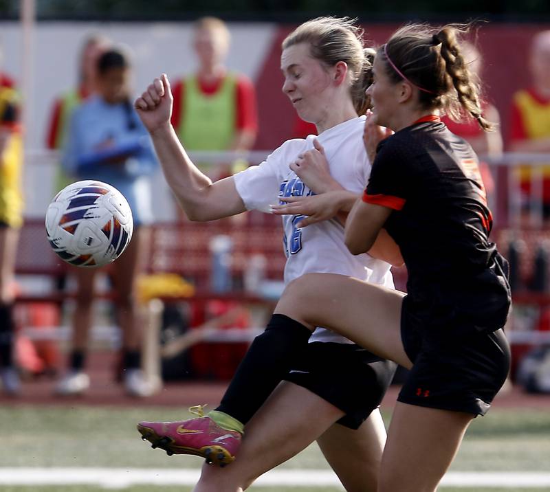 Lincoln-Way East's Julia Chonarzewski battles with Libertyville’s Molly Koch for the ball during the IHSA Class 3A state third-place match at North Central College in Naperville on Saturday, June 3, 2023.