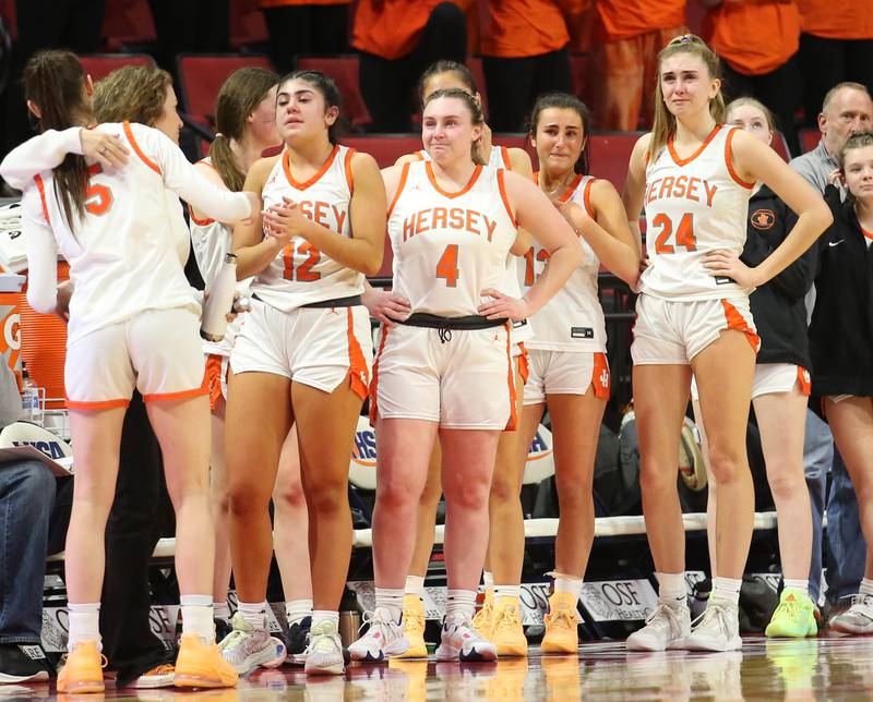 Members of the Hersey girls basketball  team react after being loosing to Geneva during the Class 4A third place game on Friday, March 3, 2023 at CEFCU Arena in Normal.