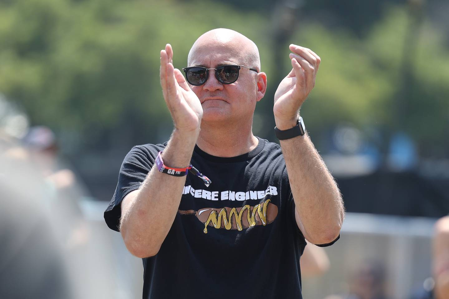 Tobin Klinger, of Chicago, wears a Sincere Engineer t-shirt as they perform on the Bud Light stage at Lollapalooza. Klinger became a fan after seeing them perform at the Thalia Hall in 2019.