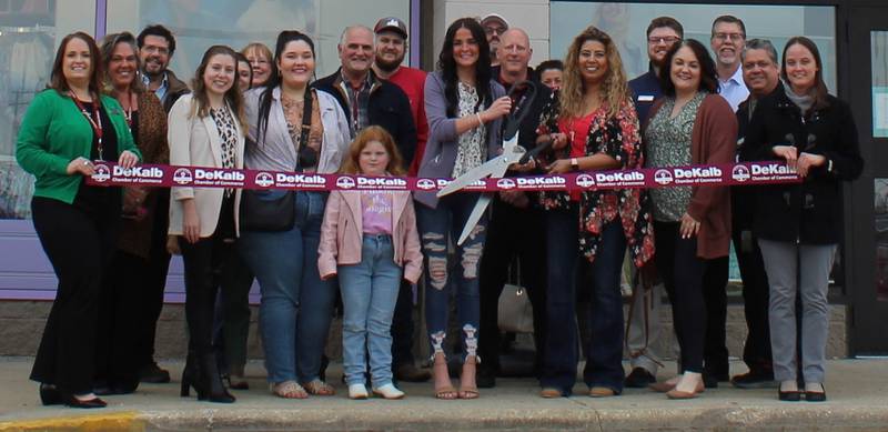 The DeKalb Chamber of Commerce welcoming Maurices and Evsie with a ribbon-cutting