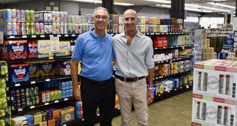 John Fotopoulos (left) and John Walano are co-owners of Main Street Wines & Spirits in Countryside. The store opened 40 years ago. And Walano was managing the deli then.