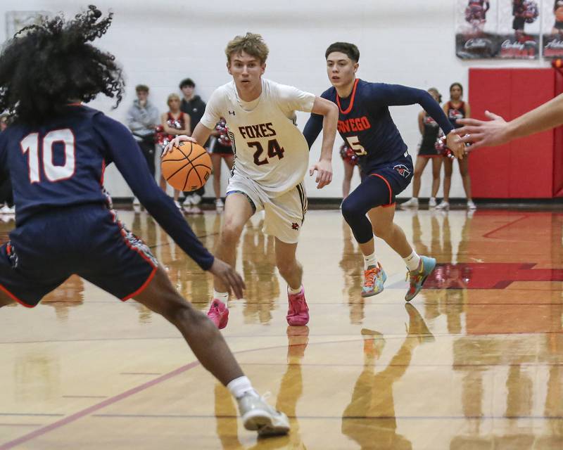 Yorkville's Nathan Kubin (24) races down the court during their basketball game between Oswego at Yorkville Friday, Dec 12, 2025 in Yorkville.
