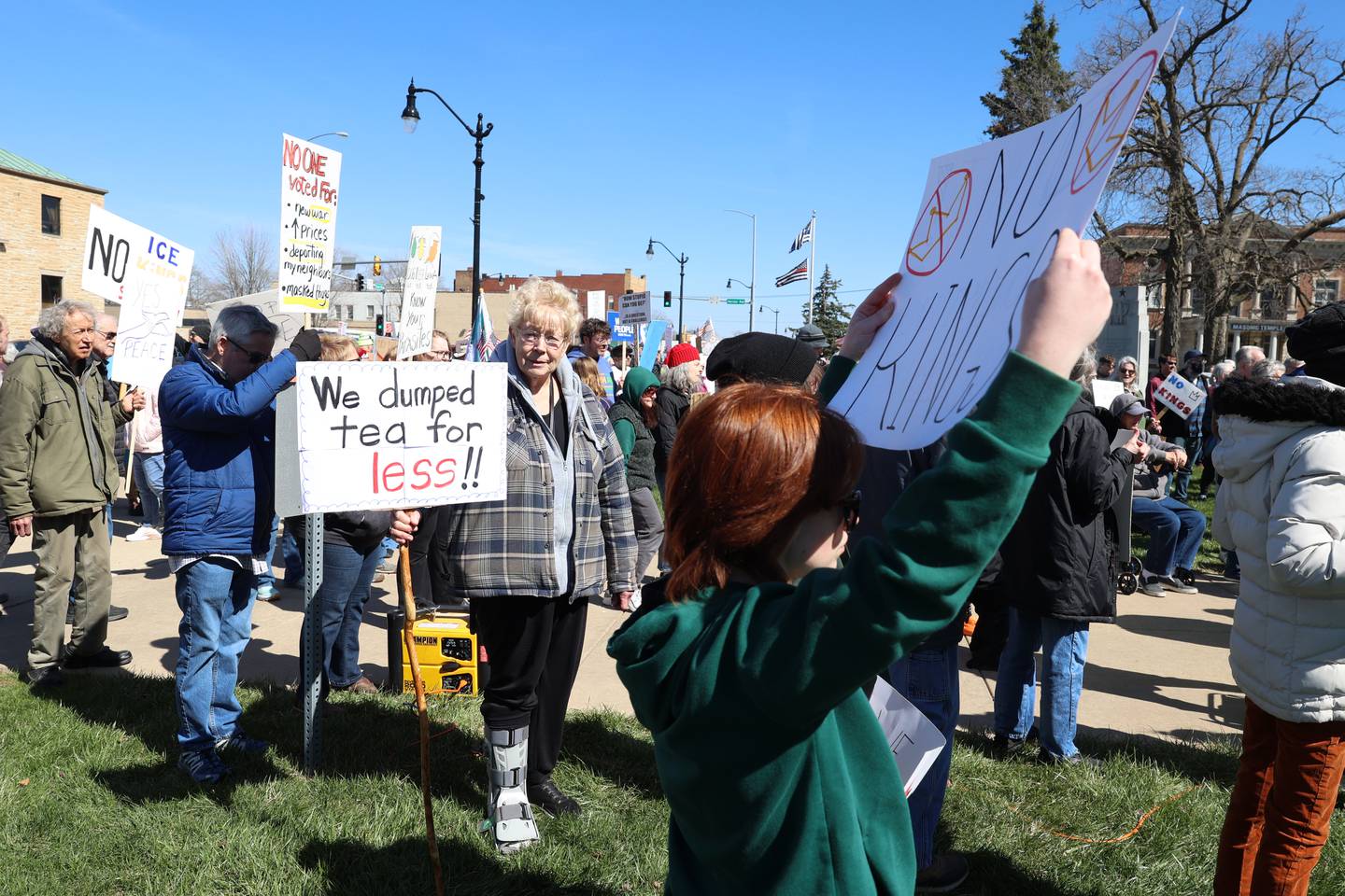 Linda Viall, of Manteno, participates in the No Kings rally at the Kankakee County Courthouse despite needing a walking boot on March 28, 2026.